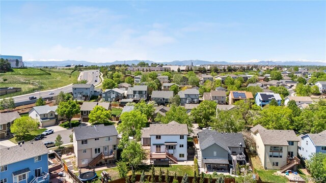 9638 Marion Way, Thornton, CO 80229 - aerial perspective of suburban area featuring a mountainous background