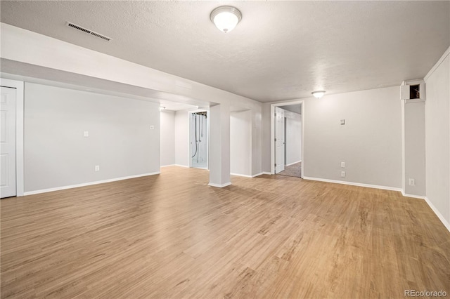 2925 Azalea St, Pueblo, CO 81005 - empty room with light wood-style flooring and a textured ceiling