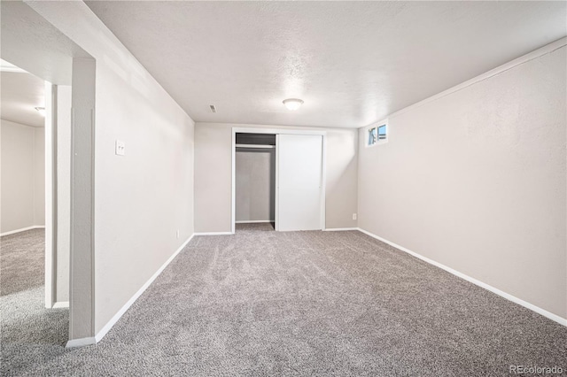 2925 Azalea St, Pueblo, CO 81005 - unfurnished bedroom with carpet floors, a closet, and a textured ceiling