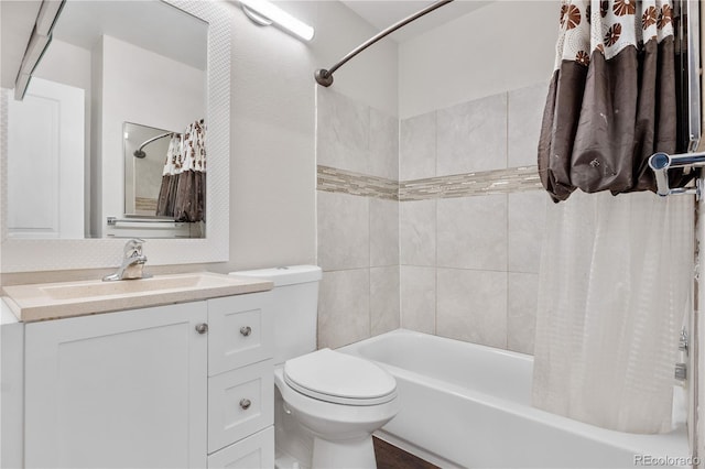 bathroom with toilet, shower / bath combo with shower curtain, and vanity