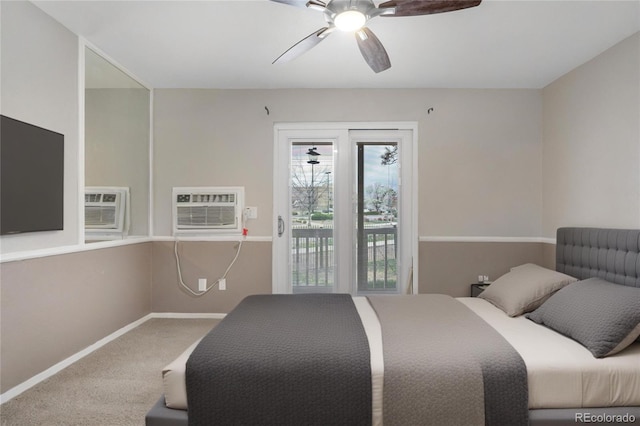 carpeted bedroom with baseboards, access to exterior, a wall mounted AC, and ceiling fan