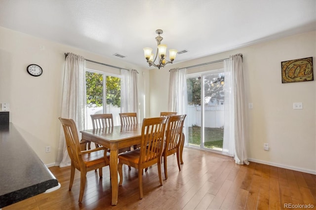 dining area featuring hardwood / wood-style floors and a wealth of natural light