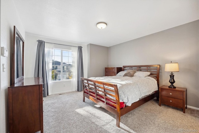 bedroom with light carpet