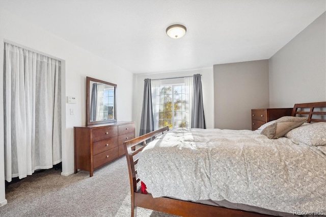 bedroom with light colored carpet