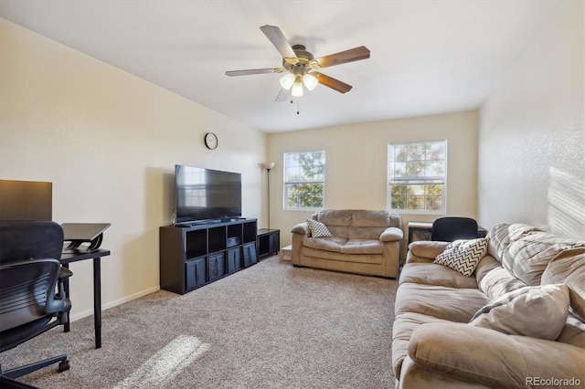 carpeted living room with ceiling fan