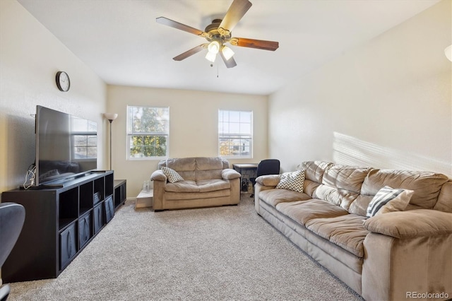 living room featuring carpet flooring and ceiling fan