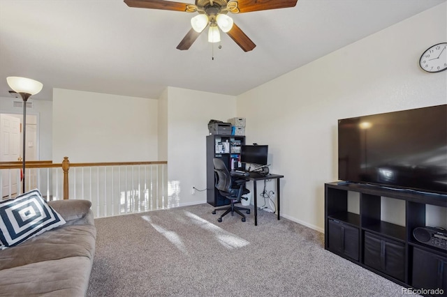 carpeted home office with ceiling fan