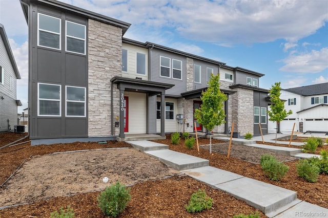 20520 E 58th Ave, Aurora, CO 80019 - contemporary home featuring stone siding and central air condition unit