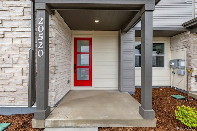 20520 E 58th Ave, Aurora, CO 80019 - doorway to property featuring stone siding