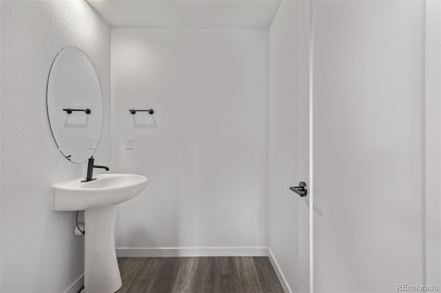20520 E 58th Ave, Aurora, CO 80019 - bathroom with wood finished floors and baseboards