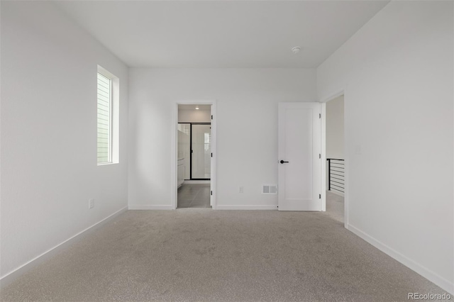 20520 E 58th Ave, Aurora, CO 80019 - empty room with carpet flooring, baseboards, and a smoke detector