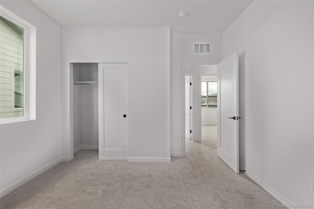 20520 E 58th Ave, Aurora, CO 80019 - unfurnished bedroom with carpet floors, baseboards, and a closet