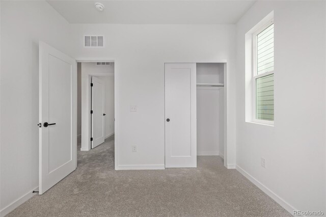 20520 E 58th Ave, Aurora, CO 80019 - unfurnished bedroom with carpet flooring, a closet, and baseboards