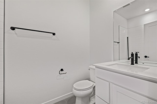 20520 E 58th Ave, Aurora, CO 80019 - bathroom featuring vanity, baseboards, and toilet
