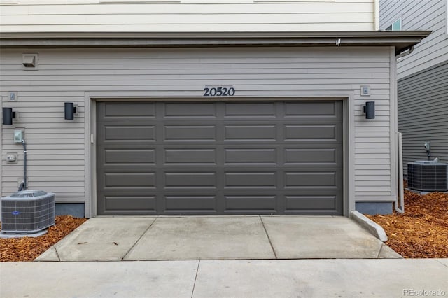 20520 E 58th Ave, Aurora, CO 80019 - garage with cooling unit and concrete driveway