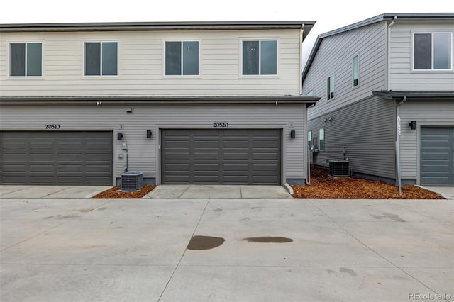 20520 E 58th Ave, Aurora, CO 80019 - garage featuring central air condition unit and concrete driveway