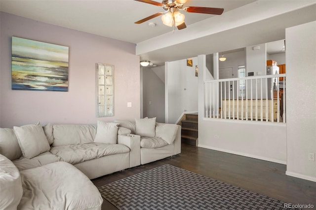 living room with dark wood-type flooring and ceiling fan