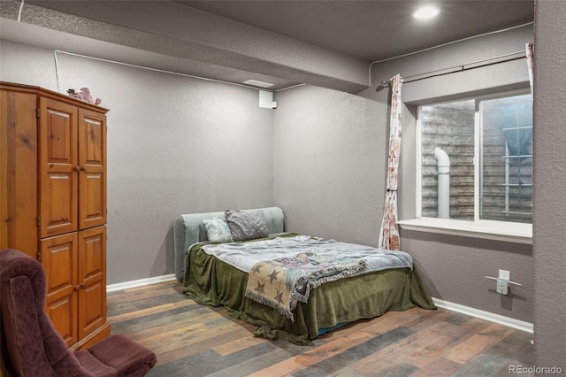 bedroom featuring dark hardwood / wood-style flooring