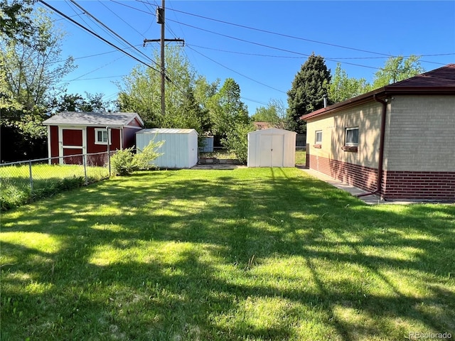 2124 S Yates St, Denver, CO 80219 - view of yard featuring a storage unit and an outdoor structure