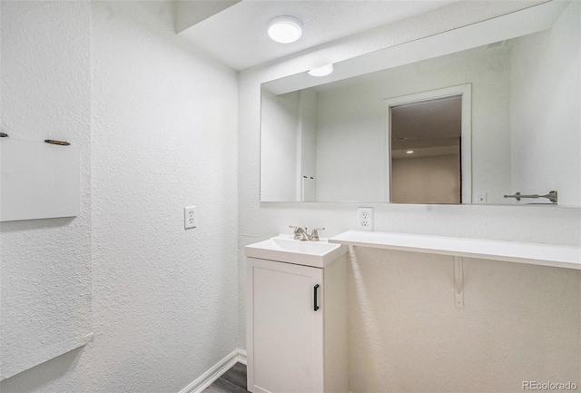 bathroom featuring wood-type flooring and vanity