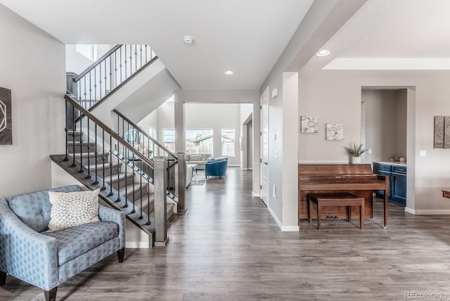 foyer entrance featuring stairway, recessed lighting, baseboards, and wood finished floors