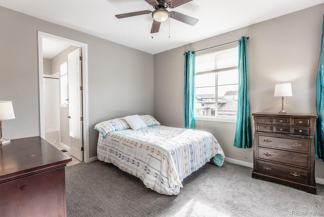 bedroom with ceiling fan, connected bathroom, baseboards, and carpet floors