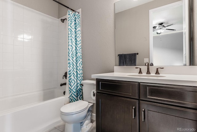 bathroom featuring tile patterned flooring, ceiling fan, toilet, shower / bath combo with shower curtain, and vanity