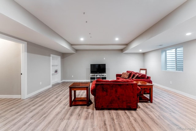 living room featuring recessed lighting, light wood-style floors, and baseboards