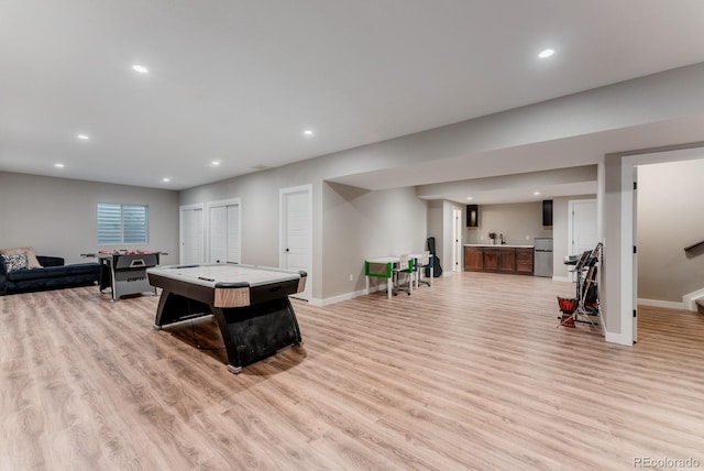 rec room with recessed lighting, light wood-style floors, and baseboards