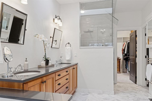 bathroom featuring vanity and a shower