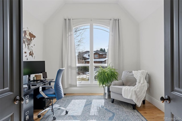 office area with hardwood / wood-style floors and lofted ceiling