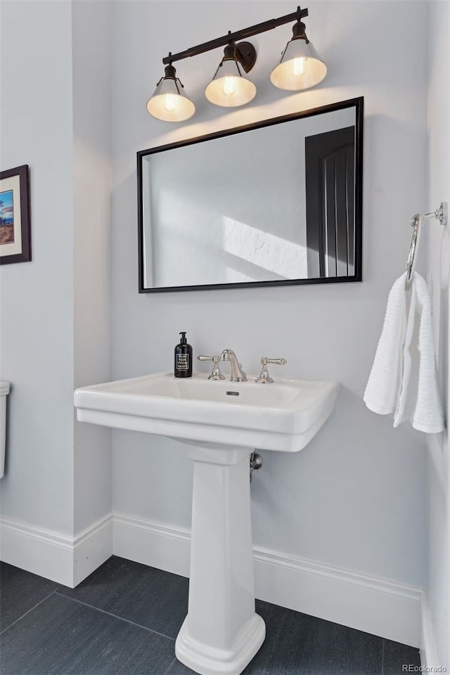 bathroom with tile patterned floors and sink