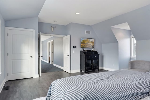 bedroom with dark hardwood / wood-style floors and vaulted ceiling