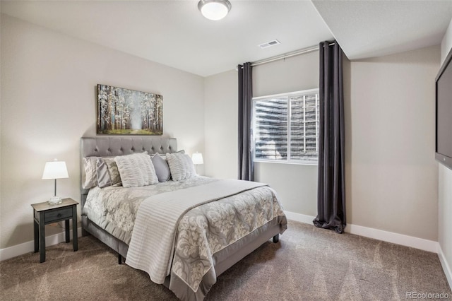 carpeted bedroom featuring baseboards
