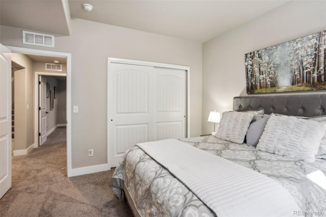 bedroom with carpet flooring, a closet, and baseboards