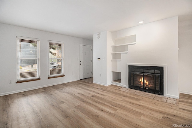 unfurnished living room featuring light hardwood / wood-style floors