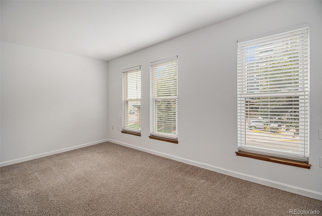 empty room with carpet flooring