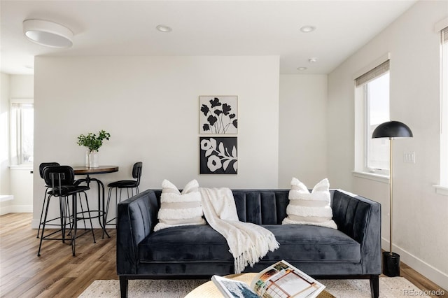 living room with recessed lighting, wood finished floors, and baseboards