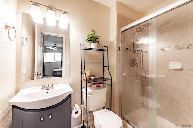 full bathroom with toilet, connected bathroom, a stall shower, and vanity