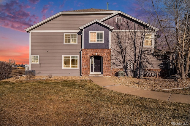 front facade with a yard