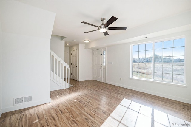 interior space with light wood-type flooring and ceiling fan