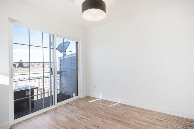 spare room featuring hardwood / wood-style flooring