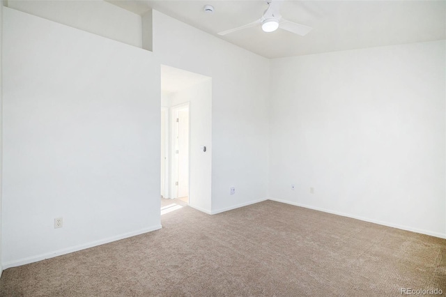 carpeted empty room featuring ceiling fan