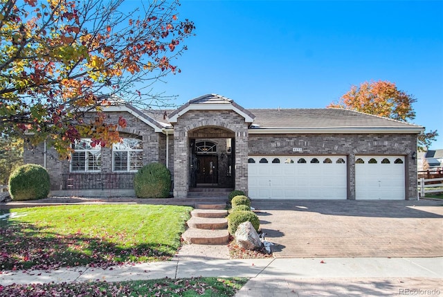 ranch-style house with a front lawn and a garage