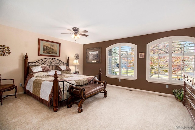 bedroom featuring ceiling fan and light colored carpet