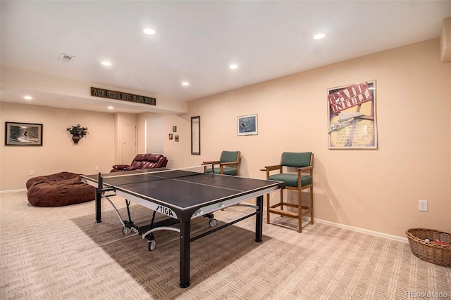 recreation room featuring light colored carpet