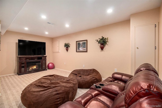 living room with light carpet and electric panel