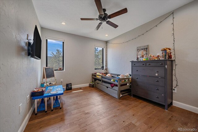 bedroom featuring ceiling fan, recessed lighting, baseboards, and wood finished floors