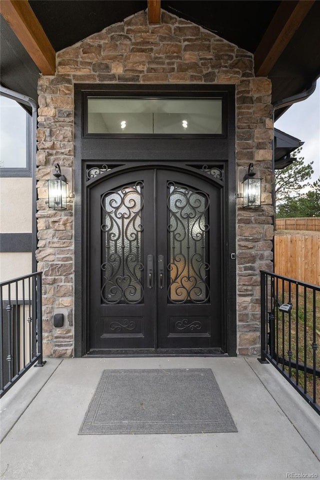 24701 US Highway 40, Golden, CO 80401 - property entrance with stone siding and french doors