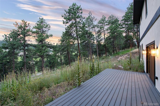 24701 US Highway 40, Golden, CO 80401 - wooden deck featuring view of wooded area